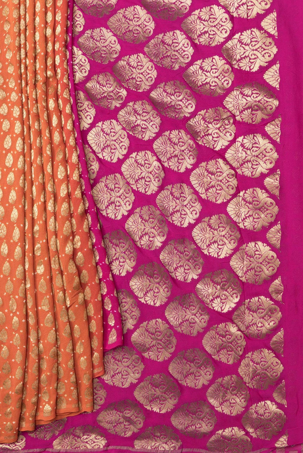 Pleats and pallu of Orange Dual Tone Mysore Georgette Saree with Zari Brocade on the body and Without Border. 