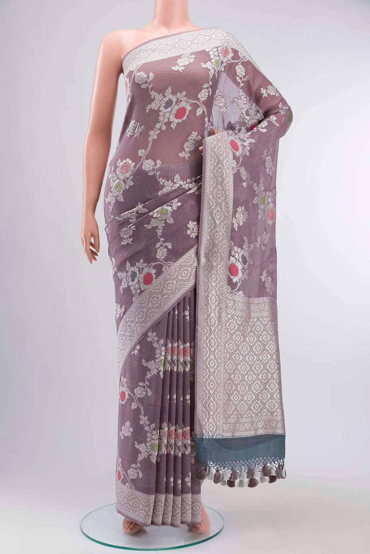 Lilac Banarasi Georgette Saree with Zari Butta on the body and Zari Border displayed on a mannequin