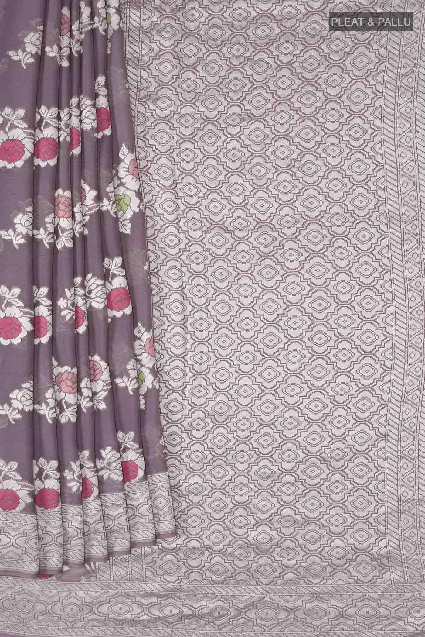 Pleats and pallu of Lilac Banarasi Georgette Saree with Zari Butta on the body and Zari Border
