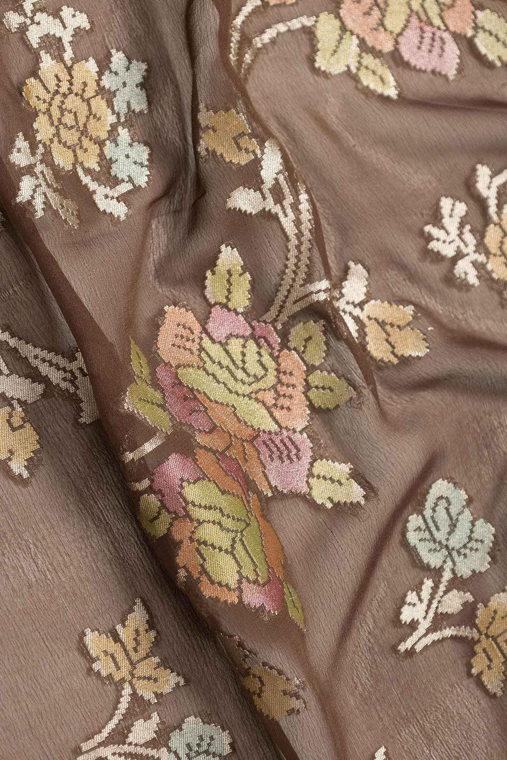 Close up of Brown Dual Tone Banarasi Saree with Zari Brocade on the body and Zari Border.  displaying folds