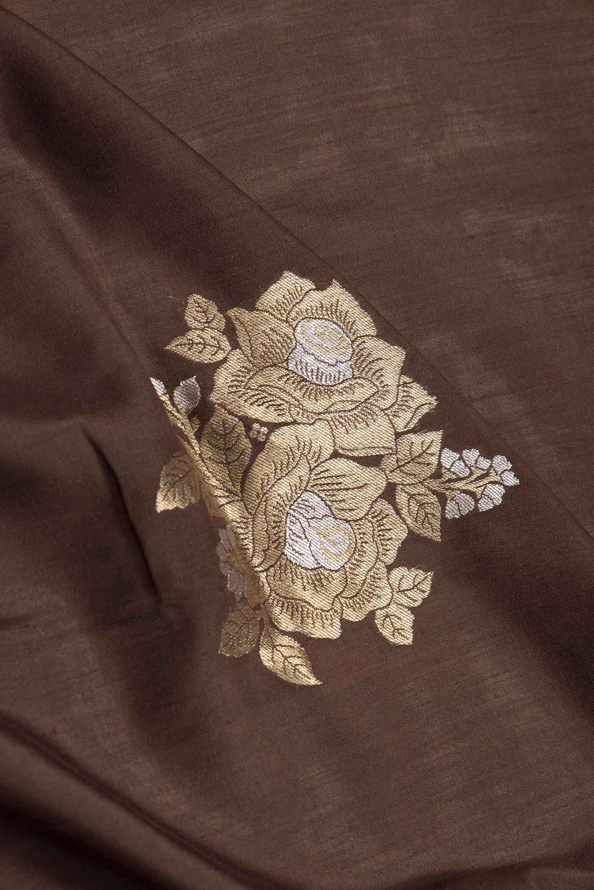 Close up of Coffee Brown Dual Tone Banarasi Saree with Zari Brocade on the body and Zari Border.  displaying folds