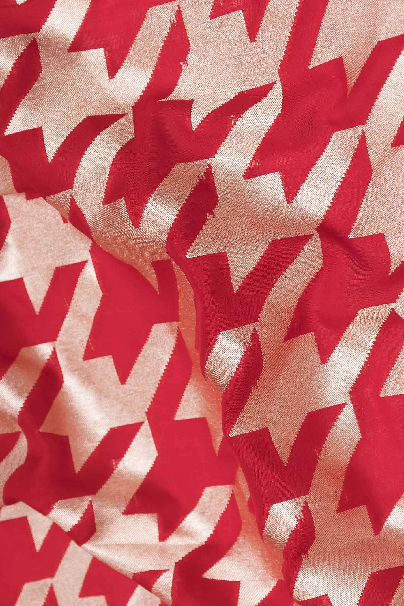Close up of Red Dual Tone Banarasi Silk Saree with Zari Butta on the body and Zari Border displaying folds