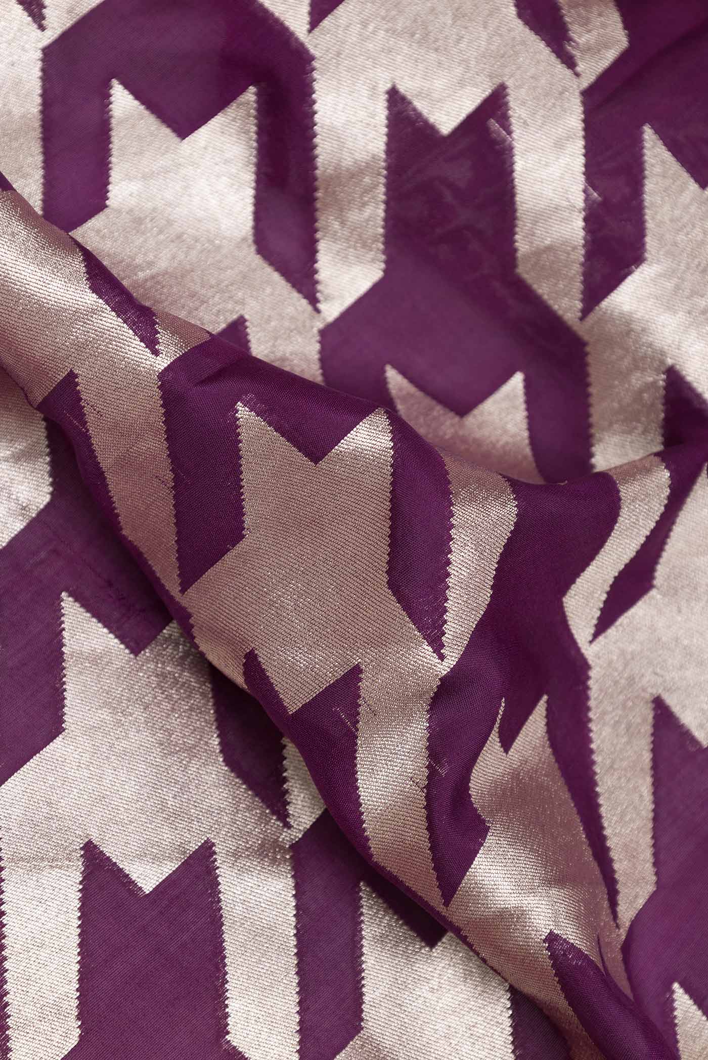 Close up of Purple Dual Tone Banarasi Silk Saree with Zari Brocade on the body and Zari Border displaying folds