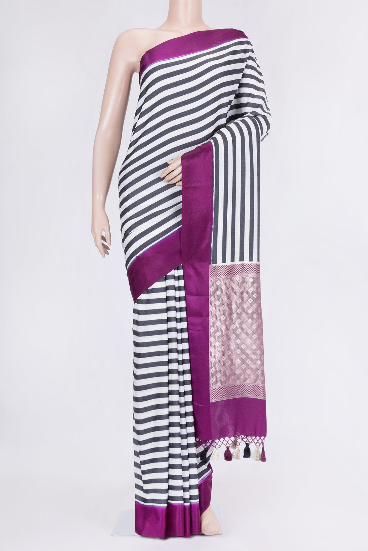 Off White and Black Color Banarasi Saree with Stripes on the body and Plain Border.  displayed on a mannequin