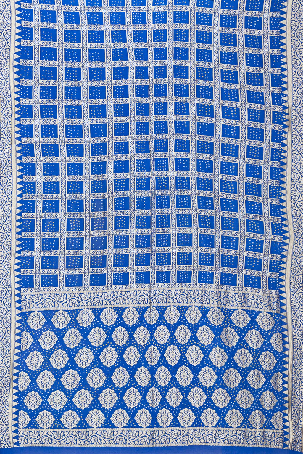 Flat view of Royal Blue Bandhani Georgette Saree with Zari Brocade on the body and Zari Border. 