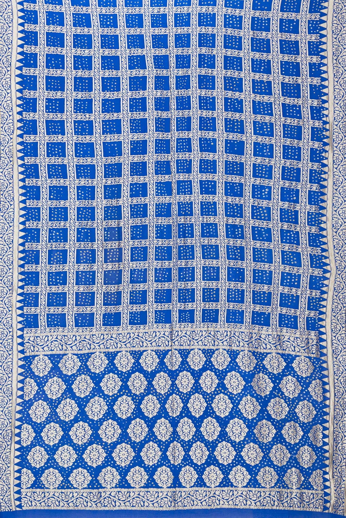 Flat view of Royal Blue Bandhani Georgette Saree with Zari Brocade on the body and Zari Border. 