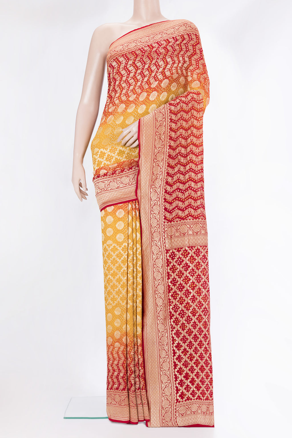 Yellow Bandhani Georgette Saree with Zari Brocade on the body and Zari Border.  displayed on a mannequin