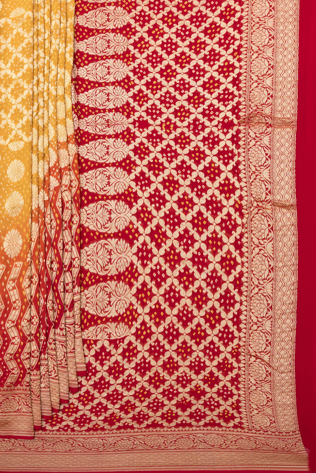 Pleats and pallu of Yellow Bandhani Georgette Saree with Zari Brocade on the body and Zari Border. 