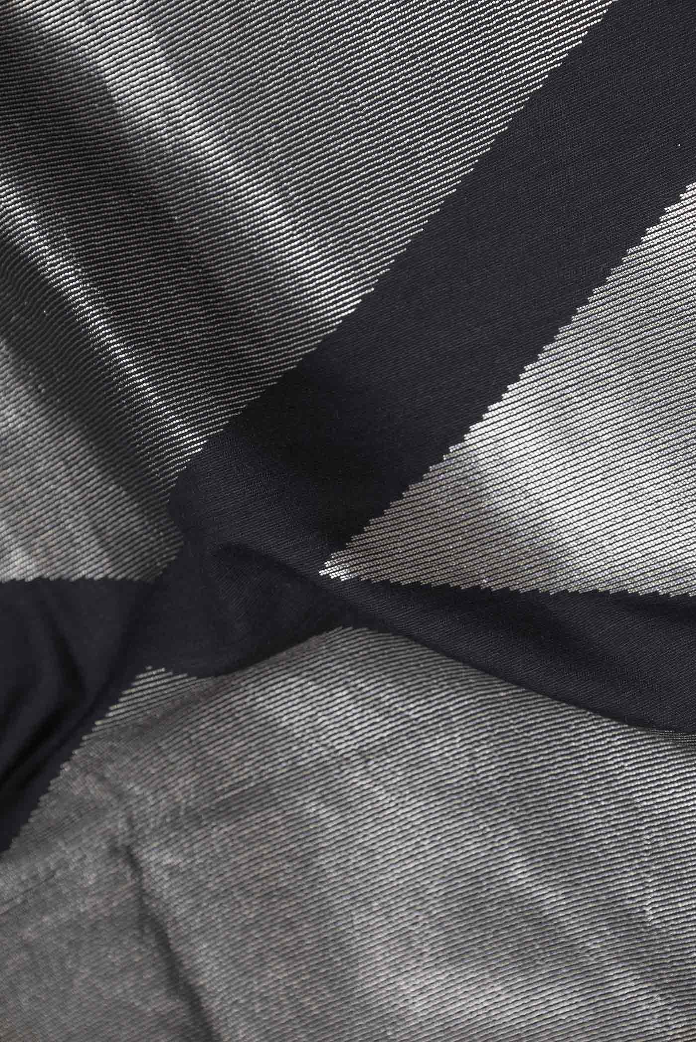 Close up of Black Dual Tone Banarasi Silk Saree with Zari Brocade on the body and Plain Border displaying folds