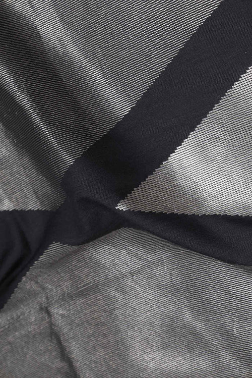 Close up of Black Dual Tone Banarasi Silk Saree with Zari Brocade on the body and Plain Border displaying folds