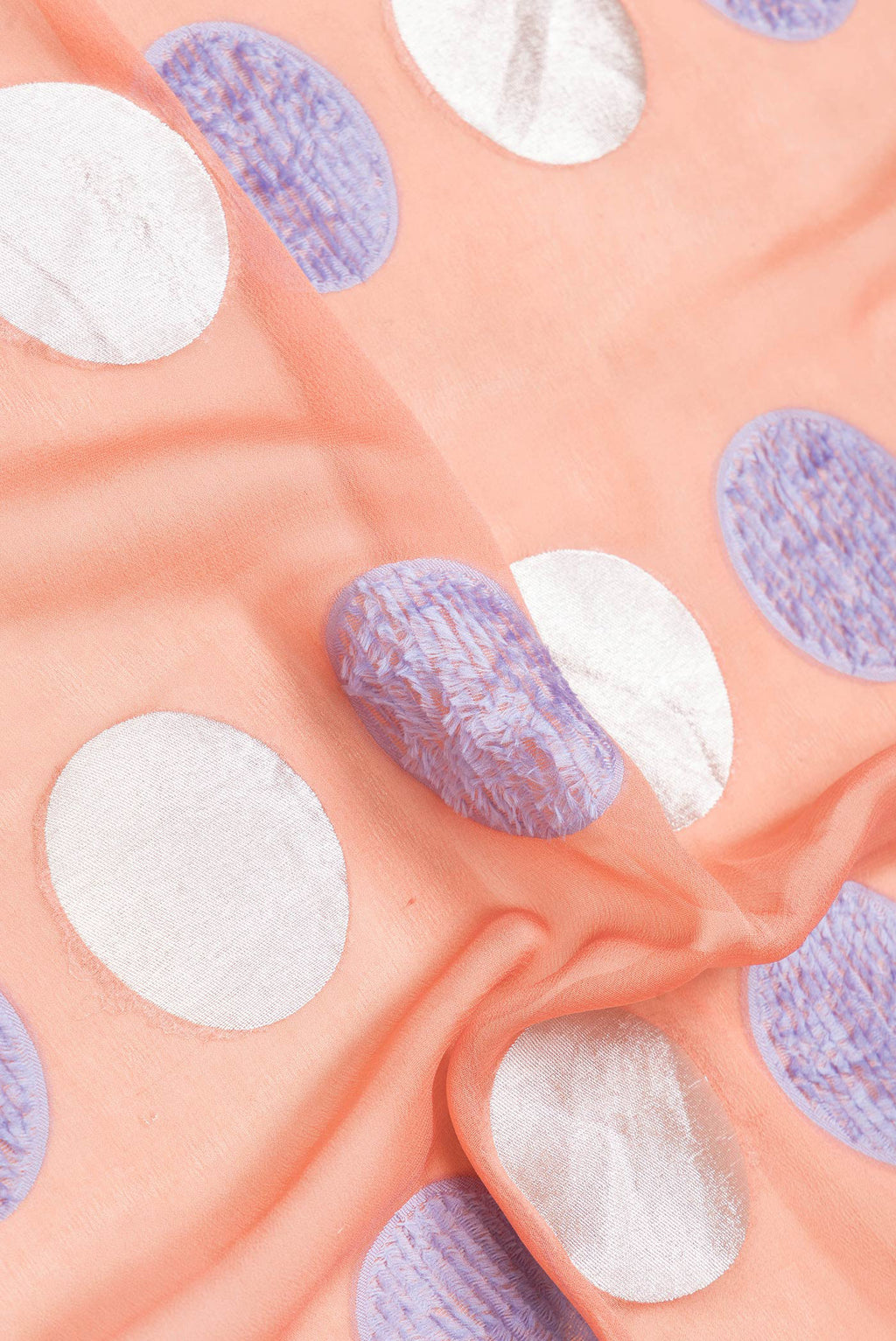 Close up of Peach Dual Tone Banarasi Georgette Saree with Zari And Thread Butta on the body and Zari Border.  displaying folds