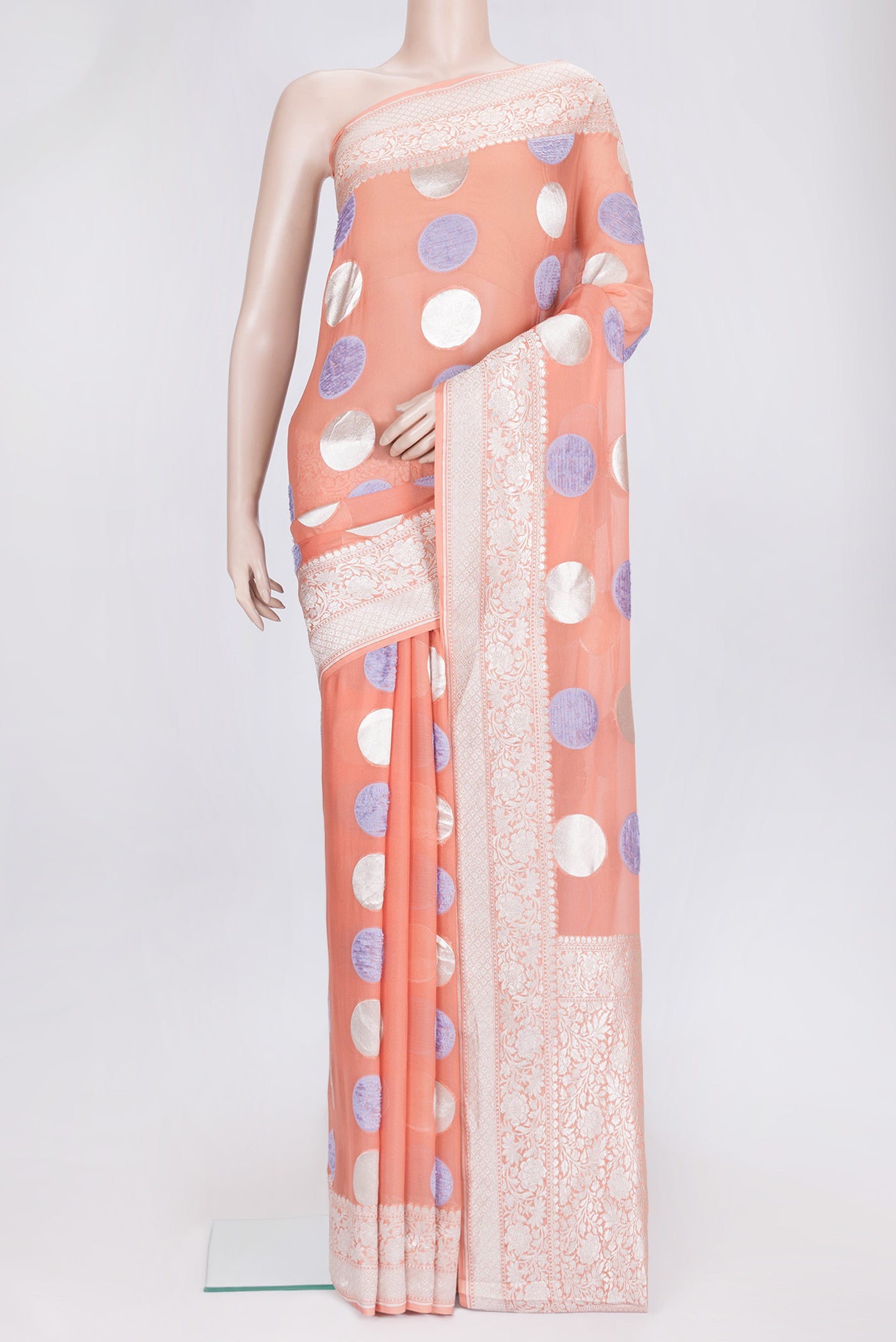 Peach Dual Tone Banarasi Georgette Saree with Zari And Thread Butta on the body and Zari Border.  displayed on a mannequin