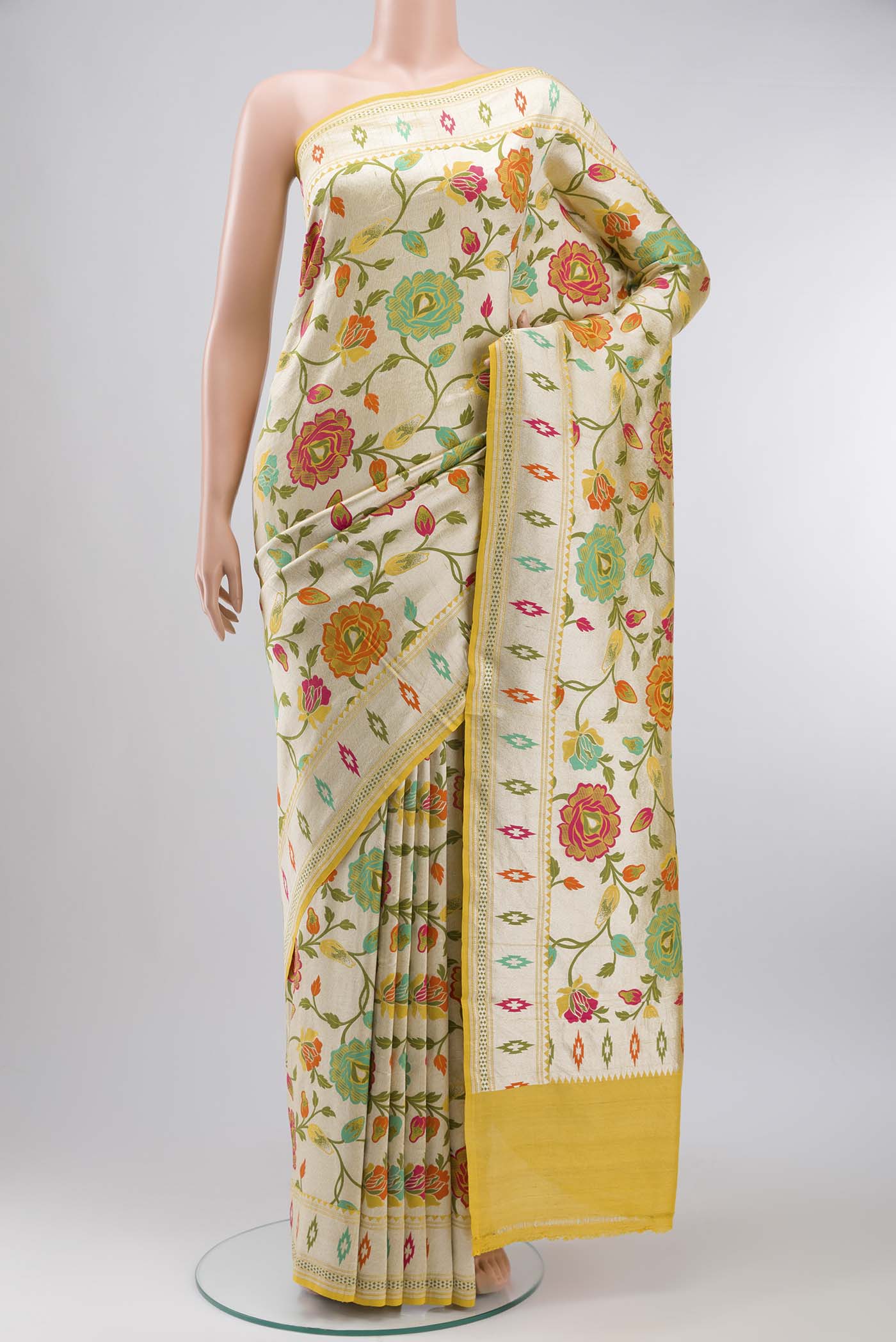 Yellow Banarasi Georgette Saree with Zari And Thread Butta on the body and Zari Border displayed on a mannequin