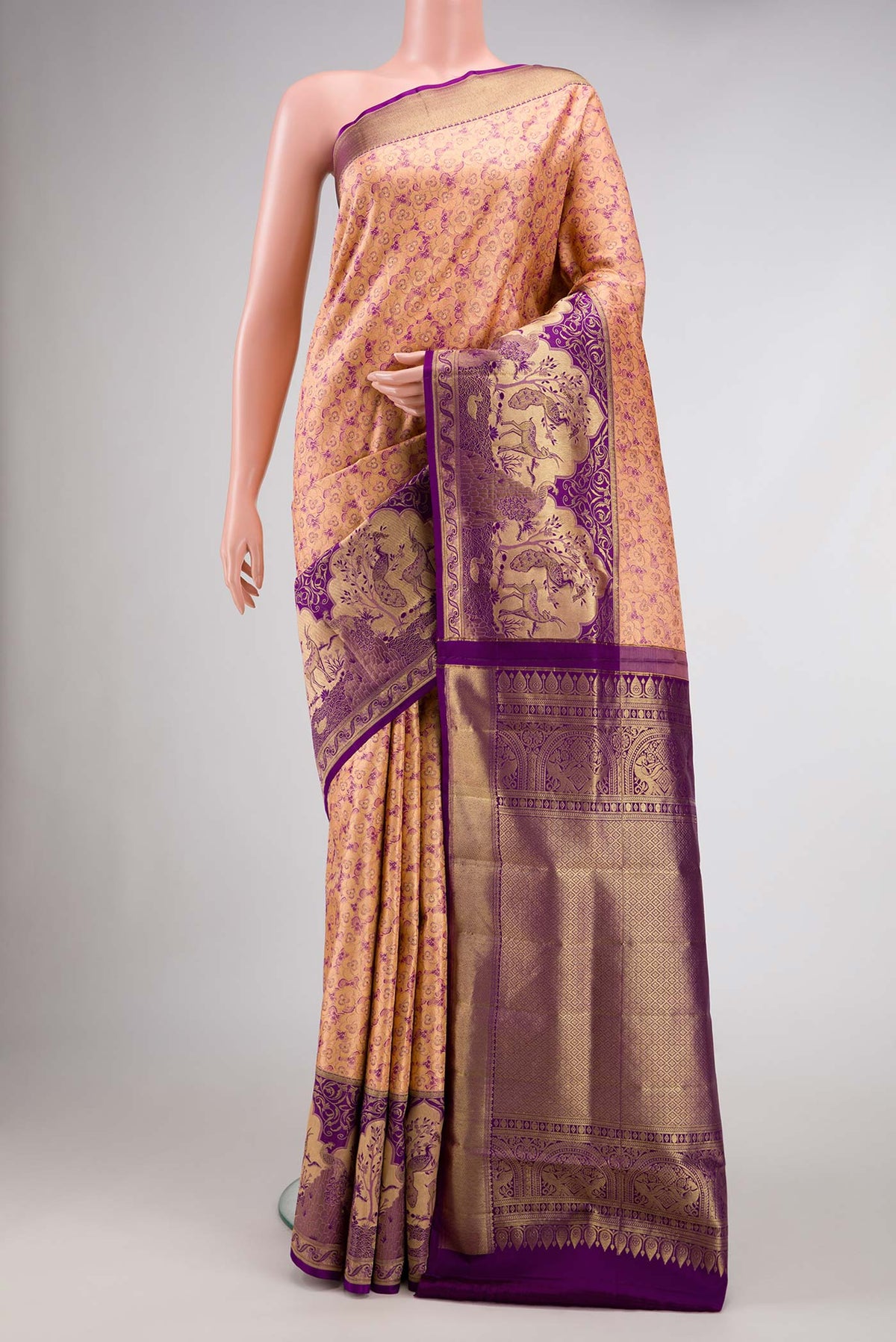 Peach Dual Tone Kanjivaram Silk Saree with Zari Brocade on the body and Zari Border.  displayed on a mannequin