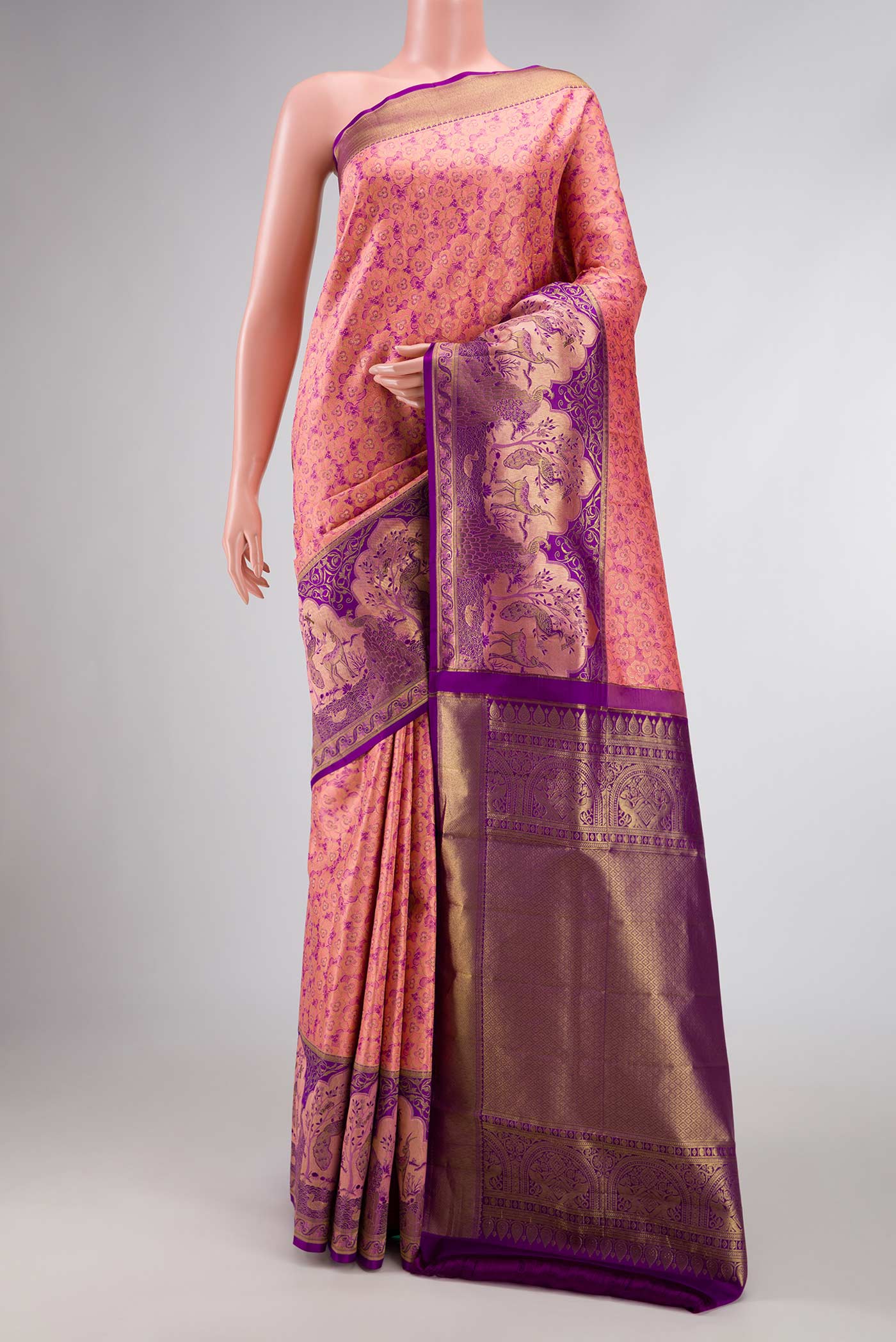 Golden Peach Dual Tone Kanchipuram Silk Saree with Zari Brocade on the body and Fancy Border displayed on a mannequin