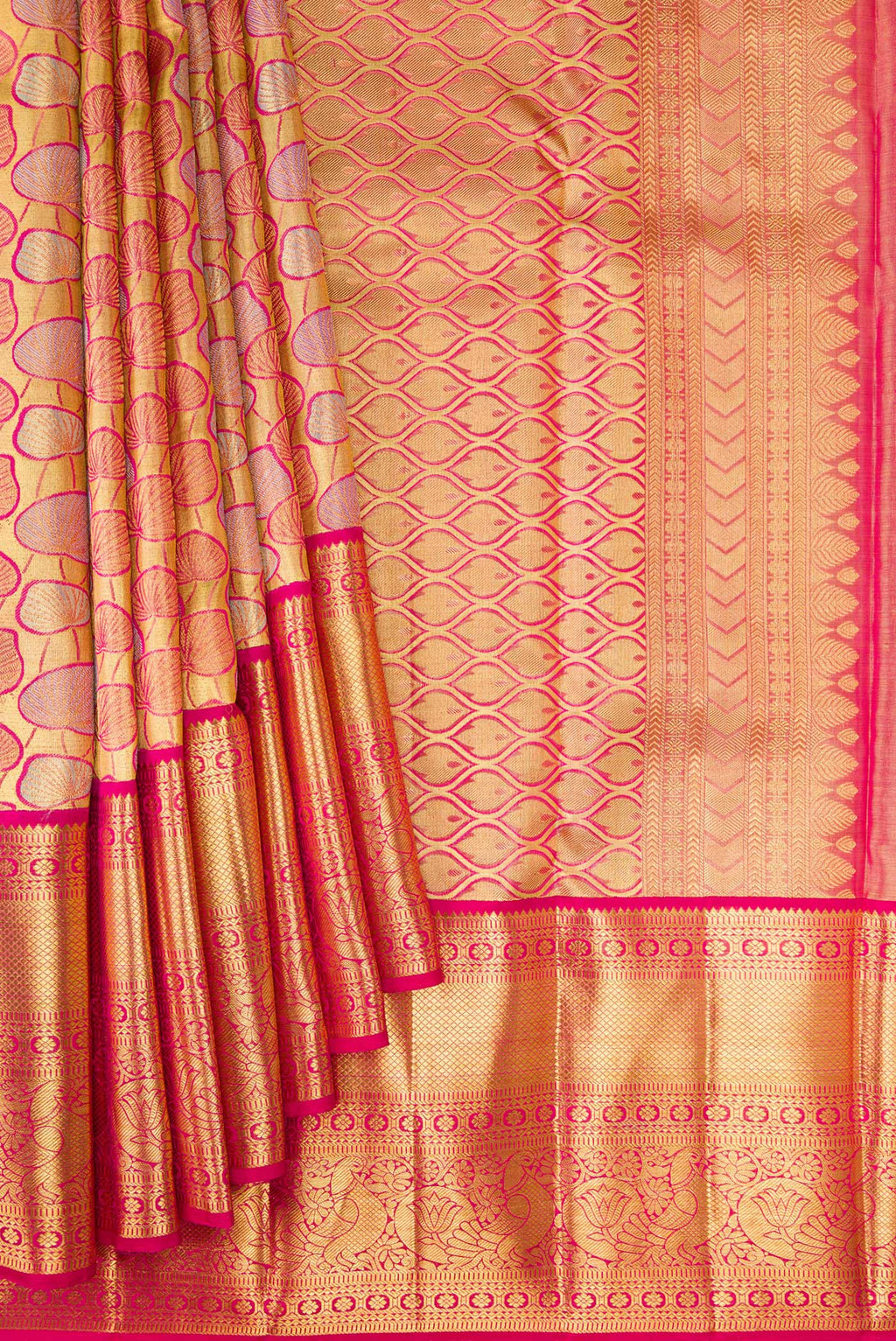 Pleats and pallu of Gold Dual Tone Kanchipuram Tissue Silk Saree with Zari Brocade on the body and Zari Border. 