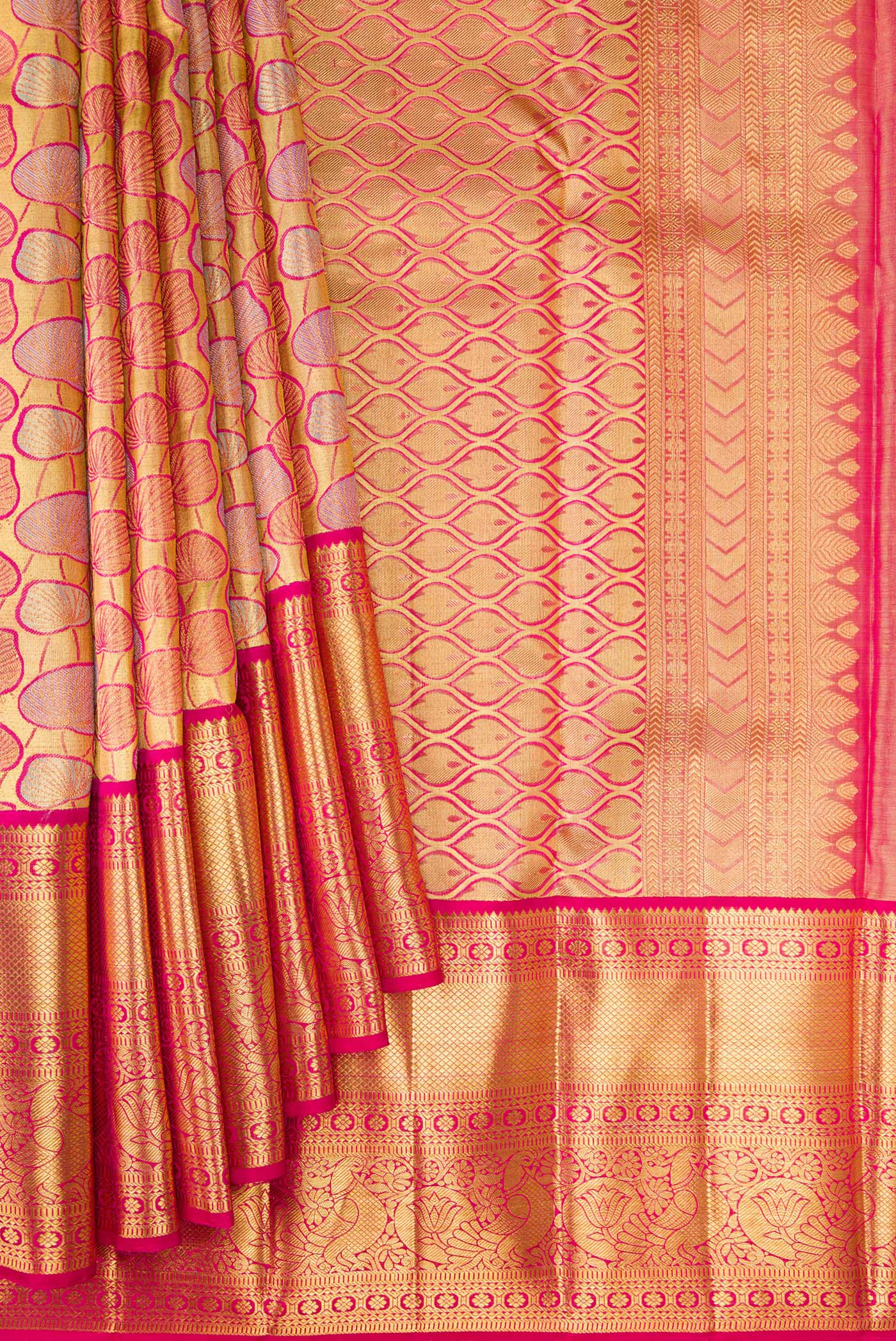 Pleats and pallu of Gold Dual Tone Kanchipuram Tissue Silk Saree with Zari Brocade on the body and Zari Border. 