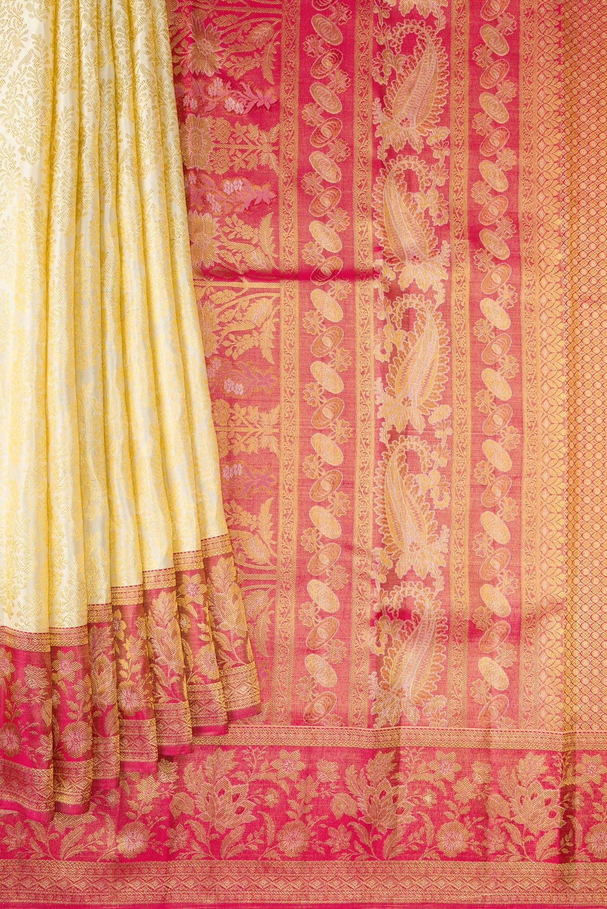 Pleats and pallu of Off White Dual Tone Kanchipuram Silk Saree with Zari Brocade on the body and Zari Border. 