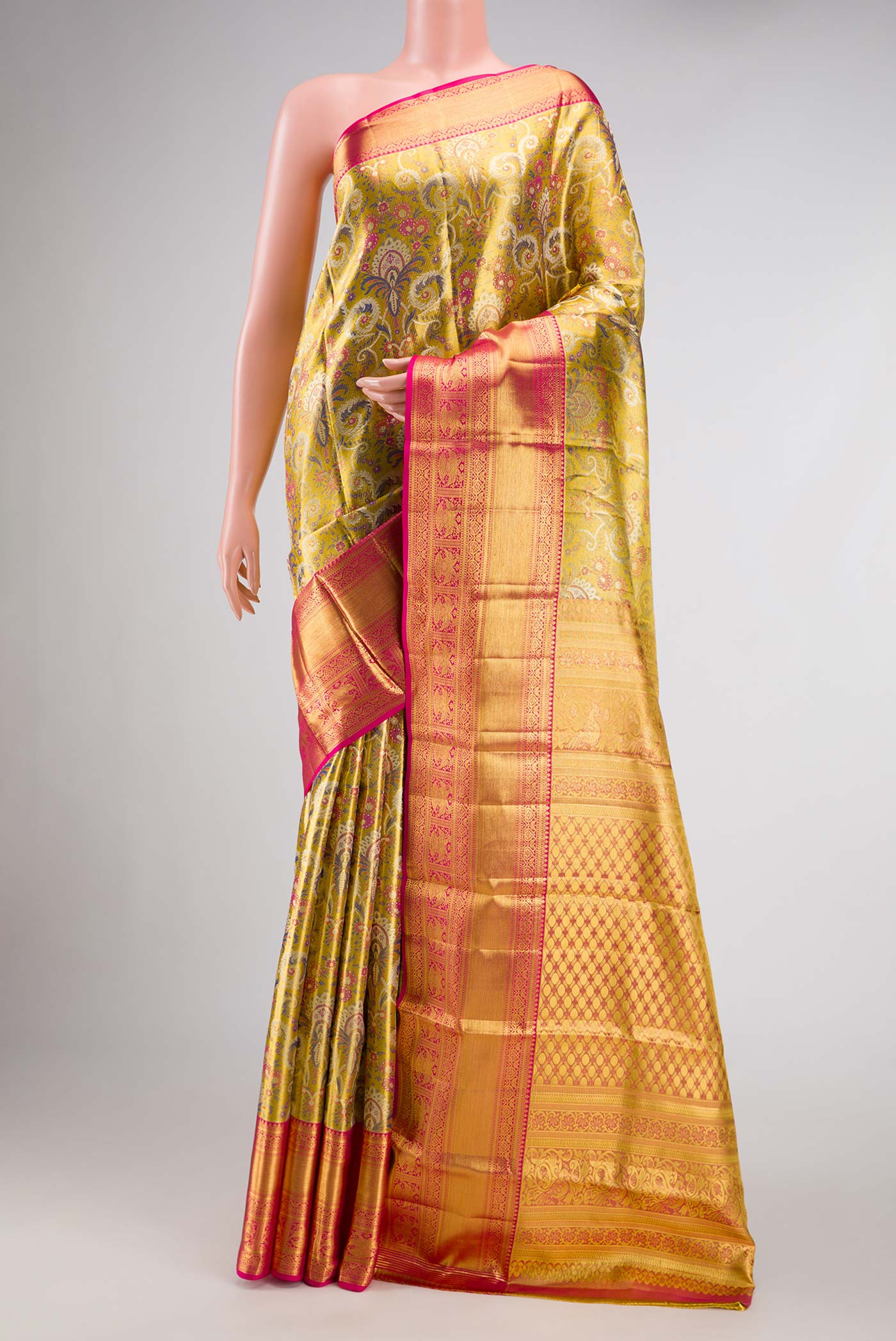 Gold Dual Tone Kanchipuram Tissue Silk Saree with Zari Brocade on the body and Zari Border.  displayed on a mannequin