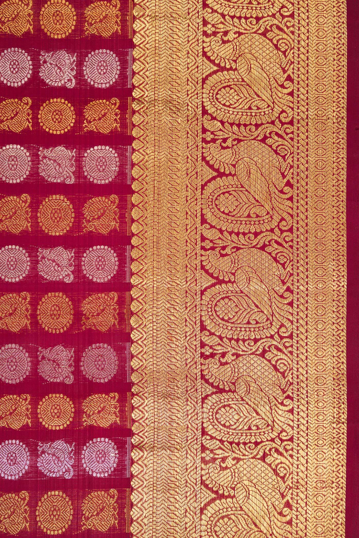 Border image of Maroon Dual Tone Kanchipuram Silk Saree with Zari Brocade on the body and Zari Border. 