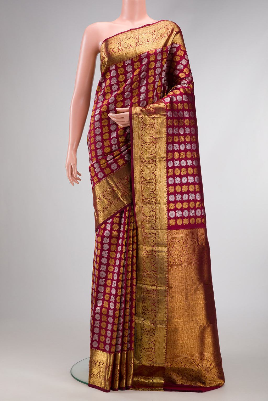 Maroon Dual Tone Kanchipuram Silk Saree with Zari Brocade on the body and Zari Border.  displayed on a mannequin