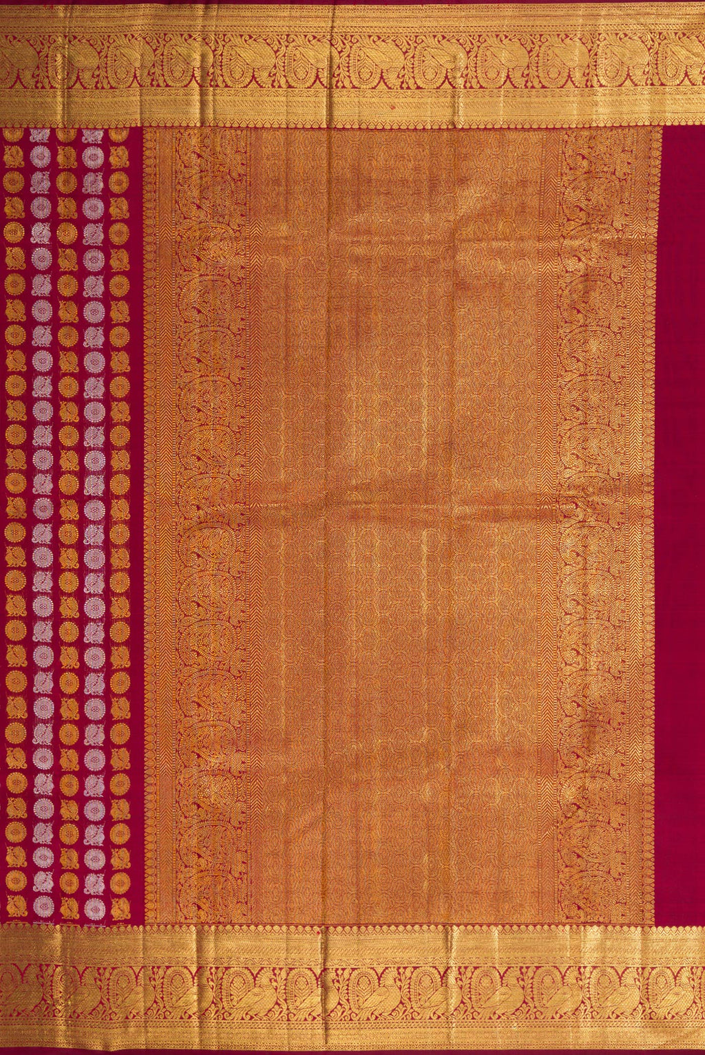 Close up image of the pallu of Maroon Dual Tone Kanchipuram Silk Saree with Zari Brocade on the body and Zari Border. 