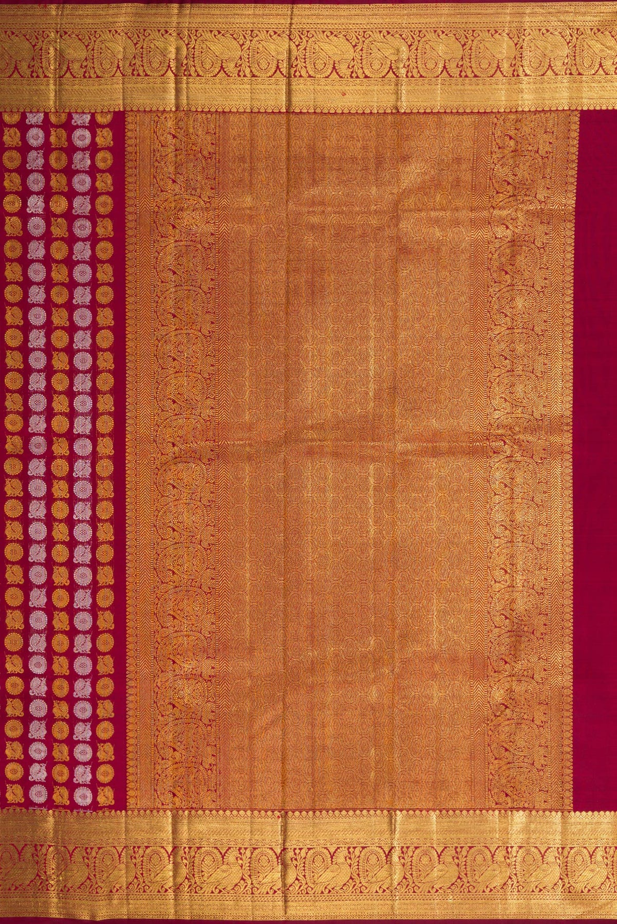 Close up image of the pallu of Maroon Dual Tone Kanchipuram Silk Saree with Zari Brocade on the body and Zari Border. 