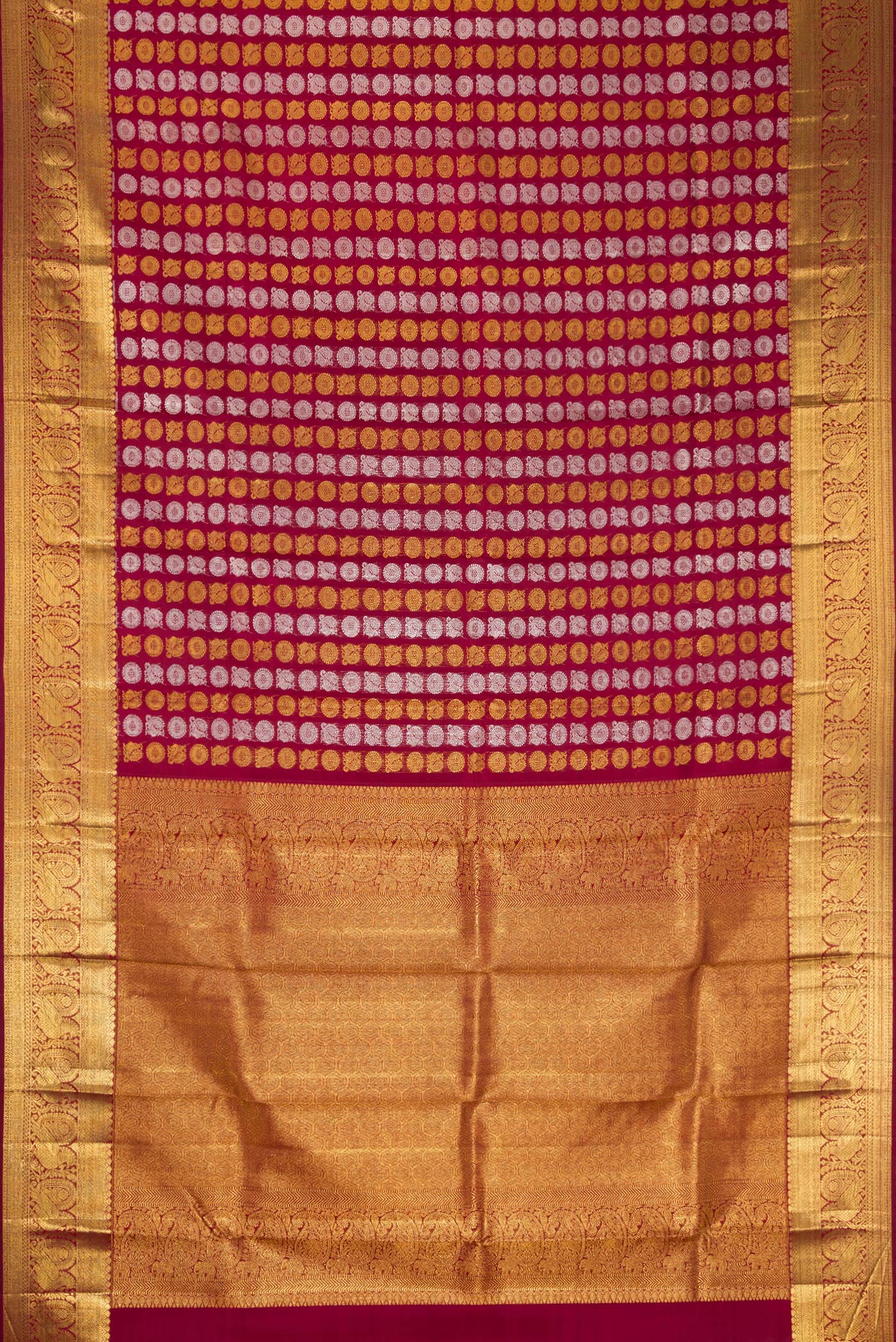 Flat view of Maroon Dual Tone Kanchipuram Silk Saree with Zari Brocade on the body and Zari Border. 