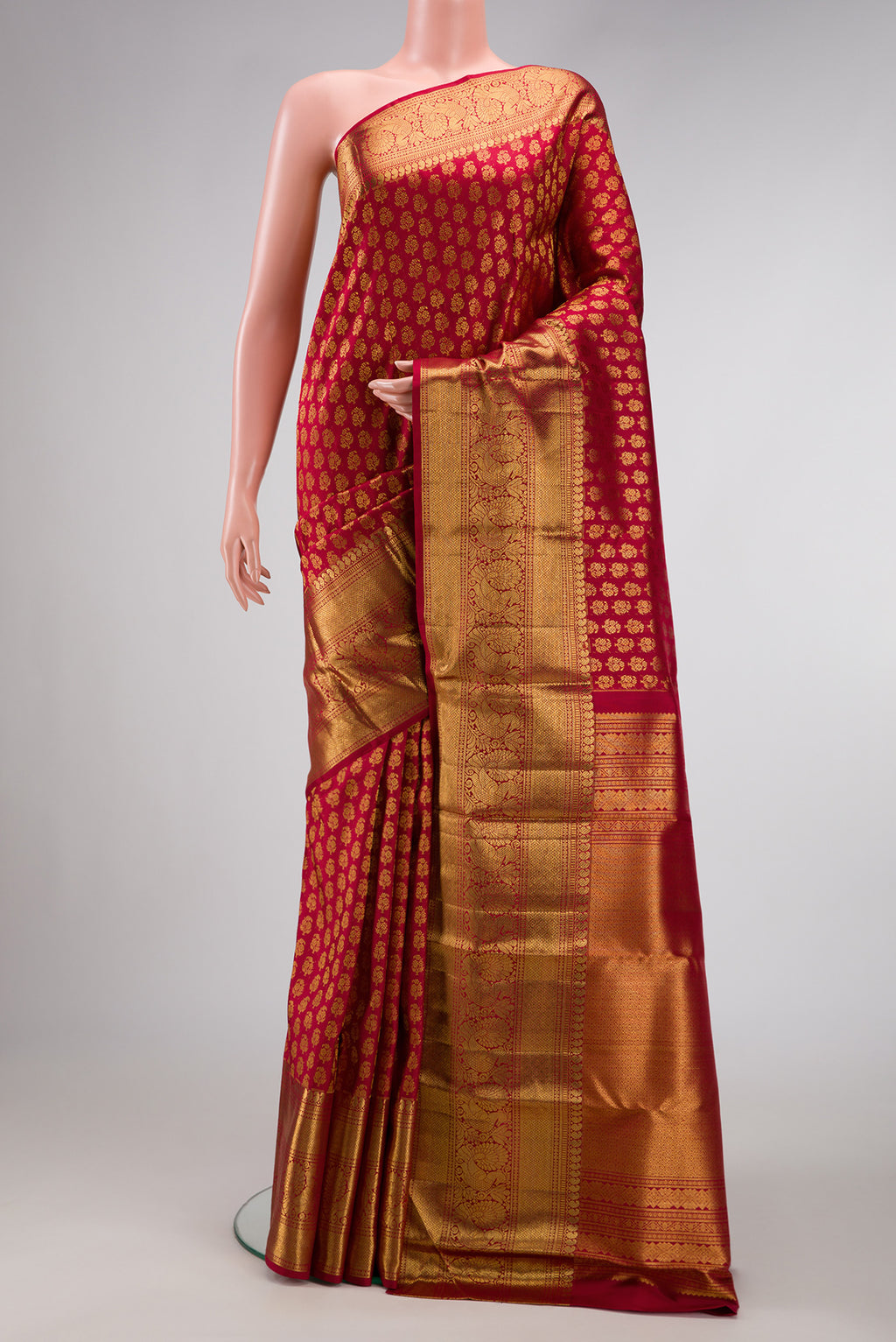 Red Dual Tone Kanchipuram Silk Saree with Zari Brocade on the body and Zari Border.  displayed on a mannequin