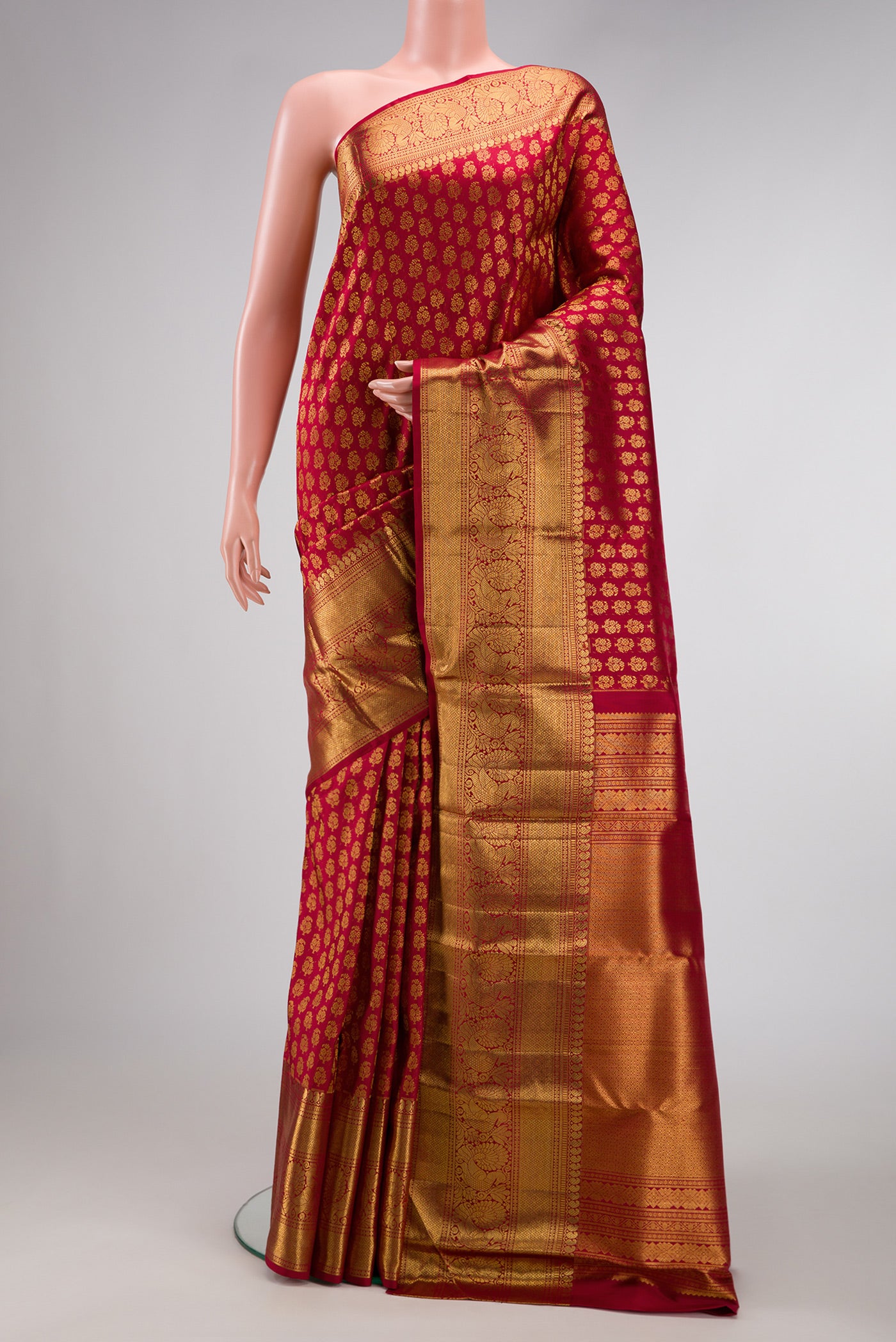 Red Dual Tone Kanchipuram Silk Saree with Zari Brocade on the body and Zari Border.  displayed on a mannequin