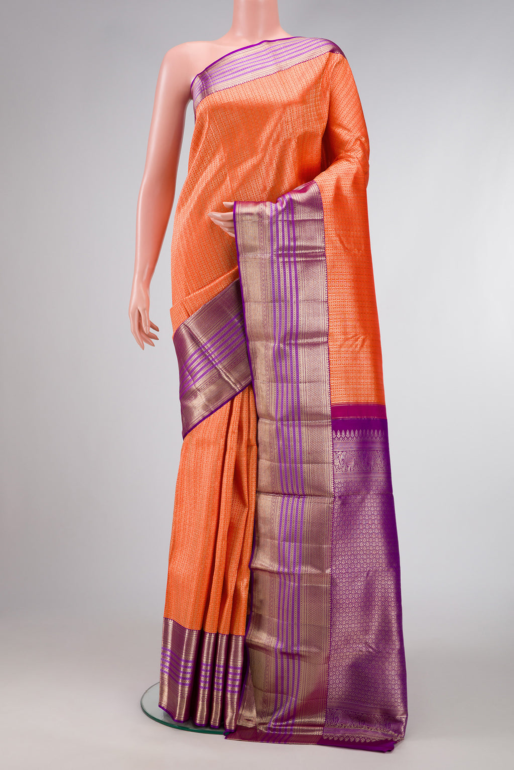 Brick Orange Dual Tone Kanchipuram Silk Saree with Zari Brocade on the body and Zari Border.  displayed on a mannequin