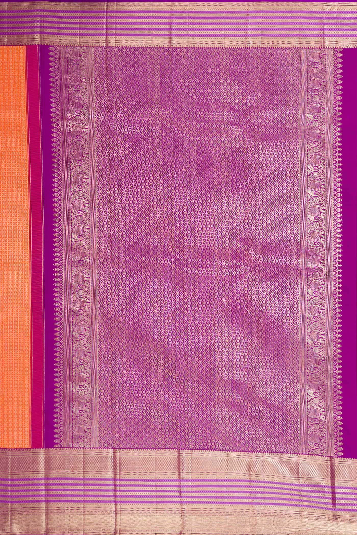Close up image of the pallu of Brick Orange Dual Tone Kanchipuram Silk Saree with Zari Brocade on the body and Zari Border. 