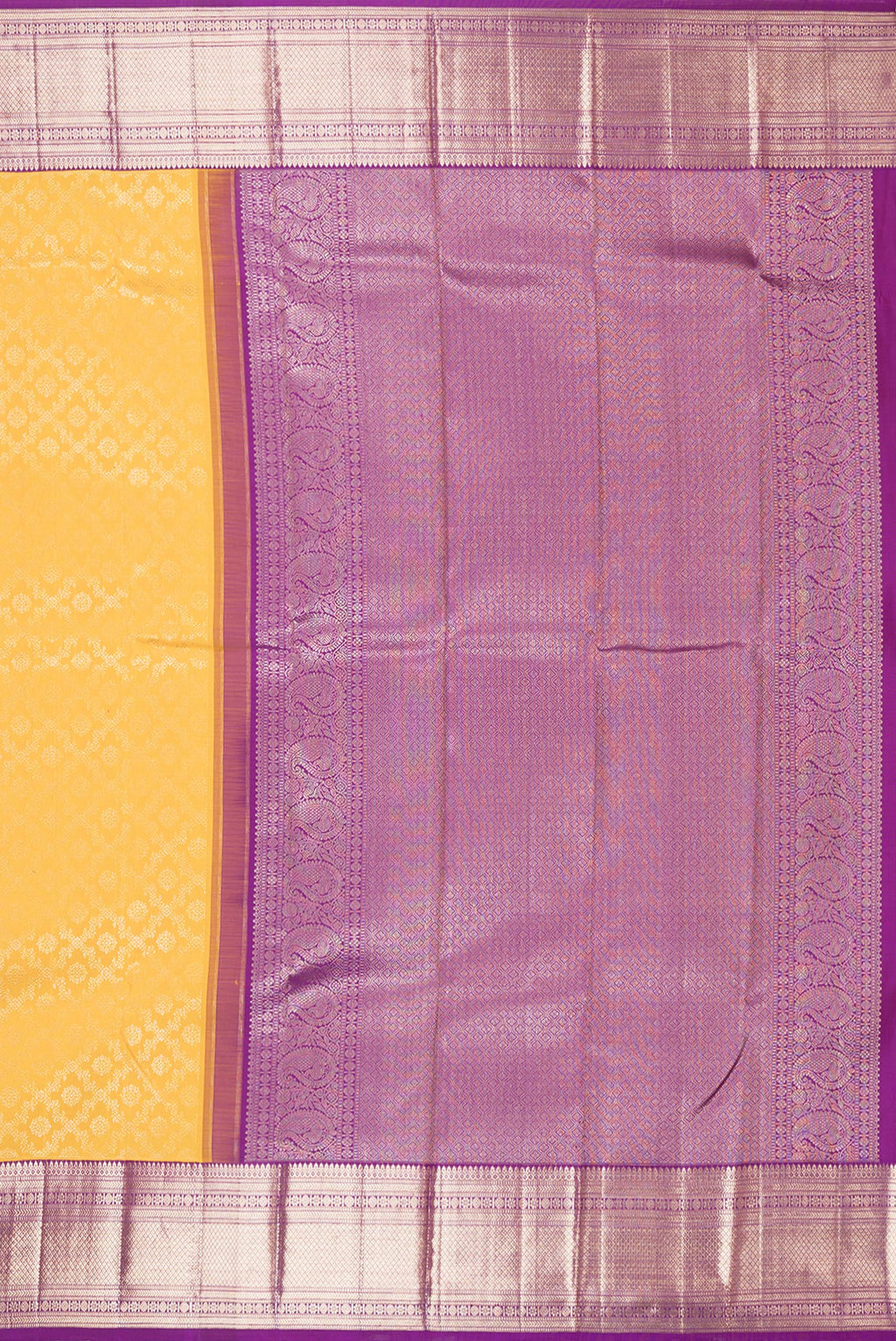 Close up image of the pallu of Pure Silk Yellow Kanchipuram Saree with Zari Brocade on the body and Zari Border. 