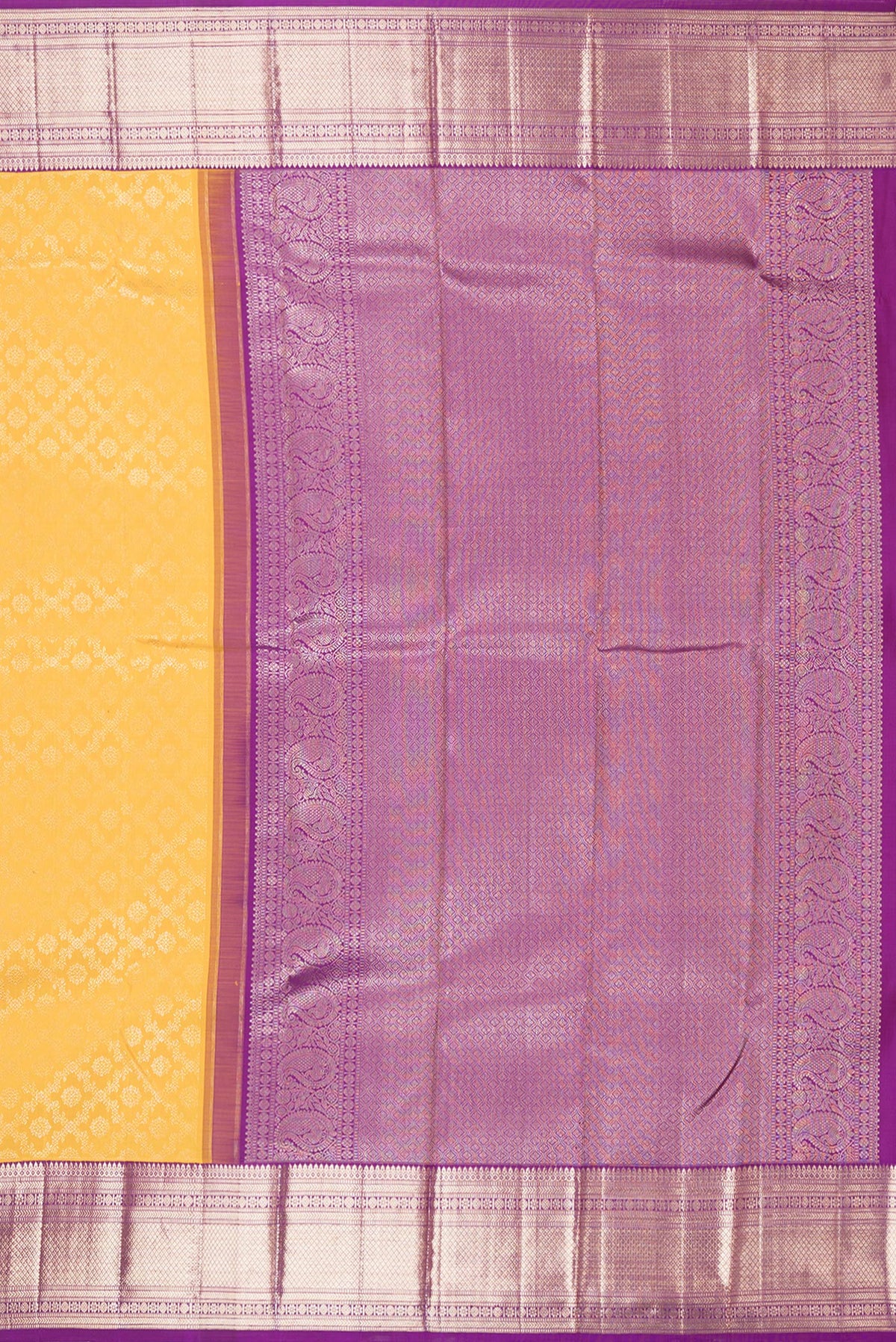 Close up image of the pallu of Pure Silk Yellow Kanchipuram Saree with Zari Brocade on the body and Zari Border. 