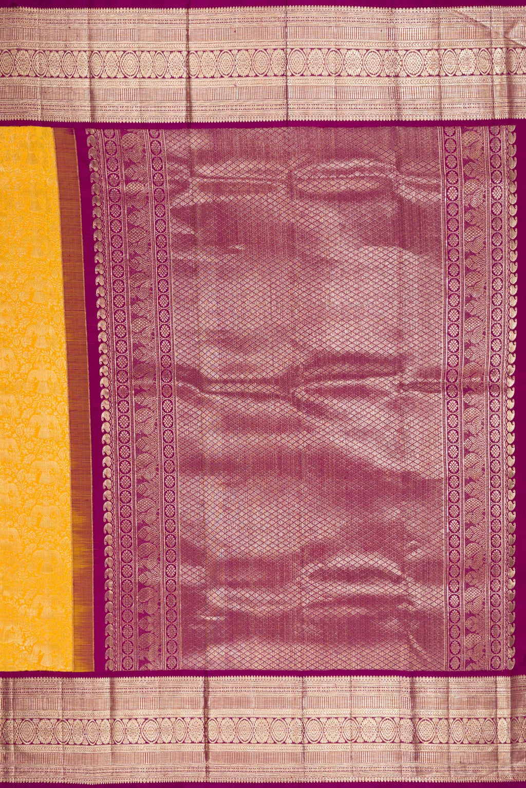 Close up image of the pallu of Yellow Kanchipuram Silk Saree with Zari Brocade on the body and Zari Border. 