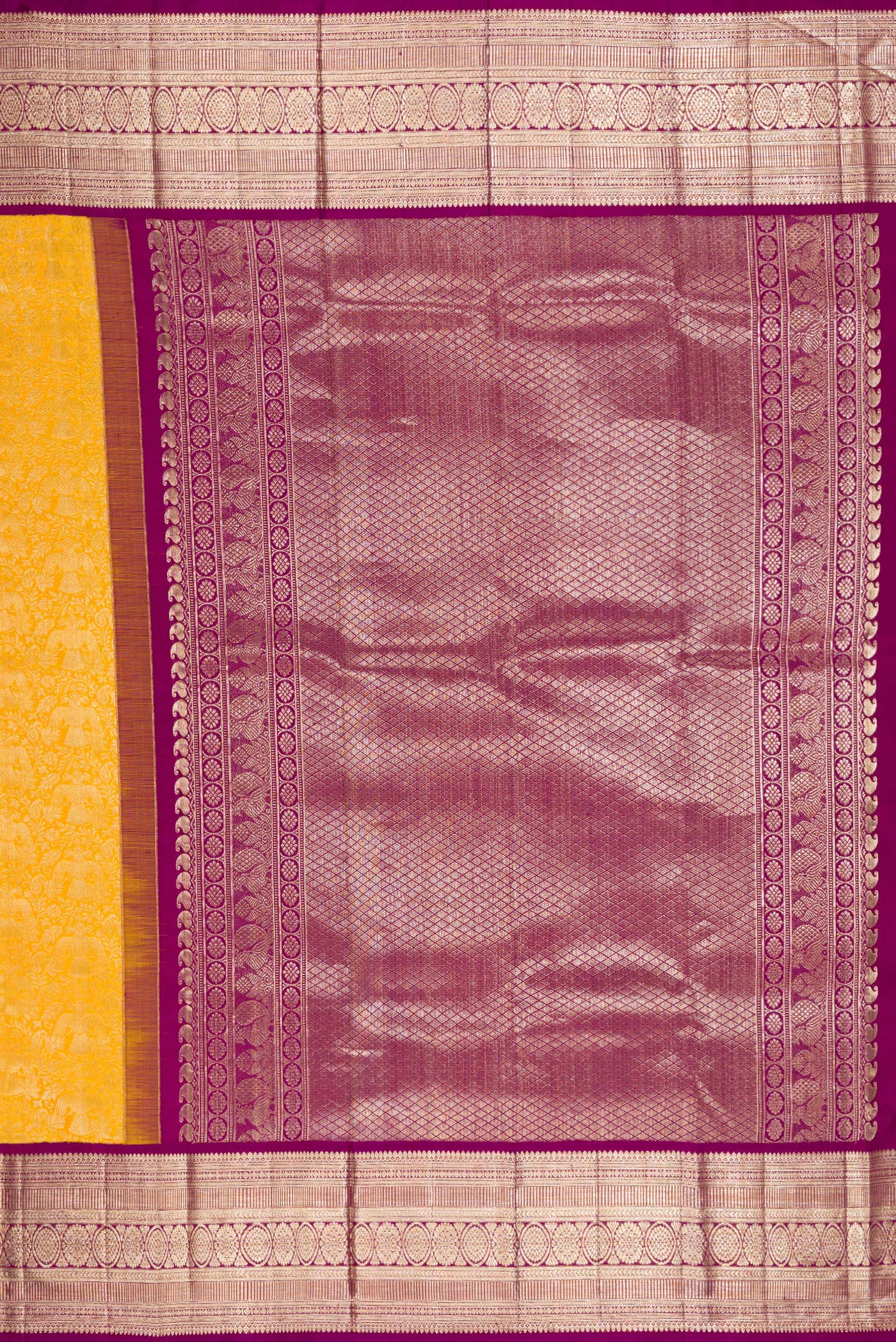 Close up image of the pallu of Yellow Kanchipuram Silk Saree with Zari Brocade on the body and Zari Border. 