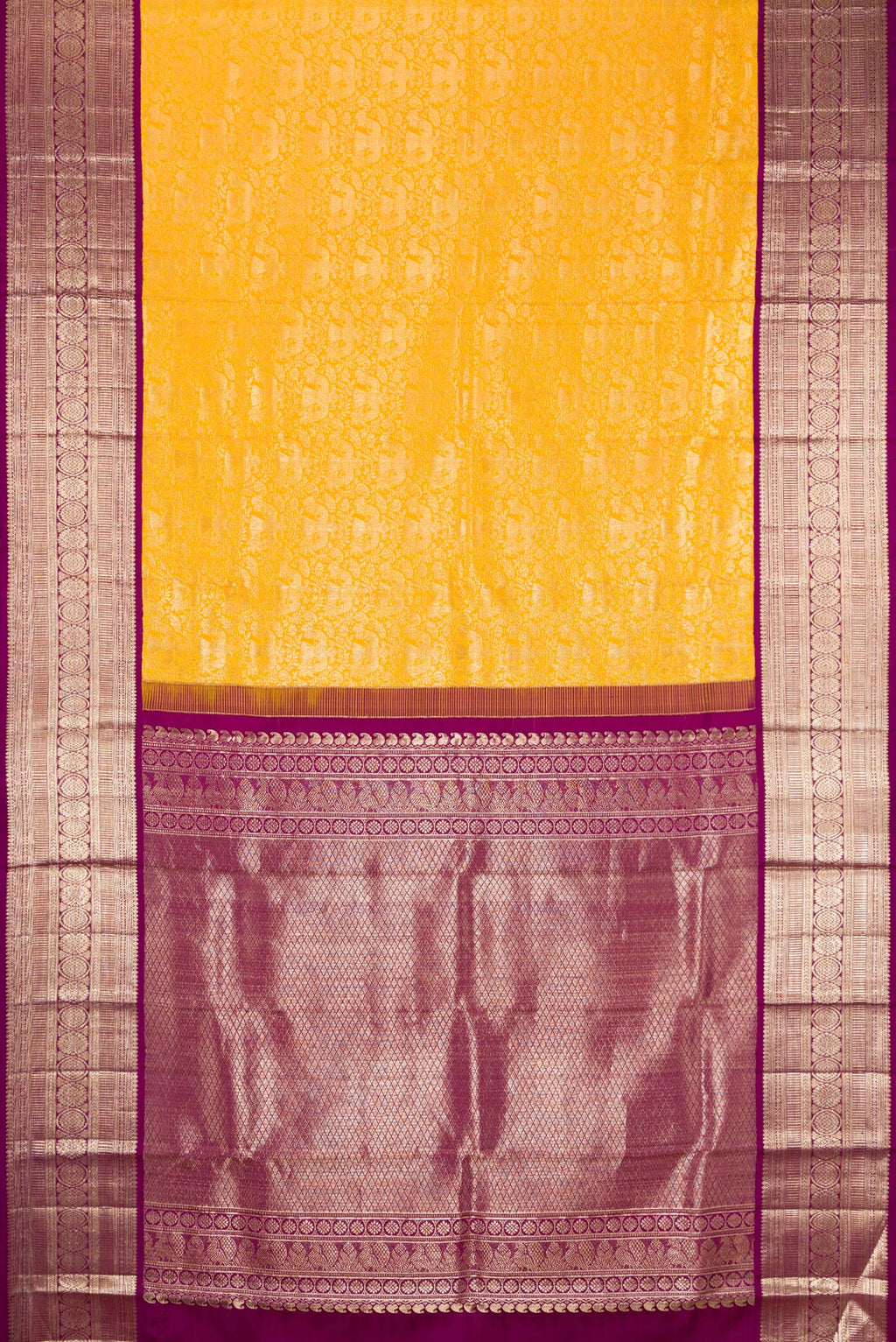 Flat view of Yellow Kanchipuram Silk Saree with Zari Brocade on the body and Zari Border. 
