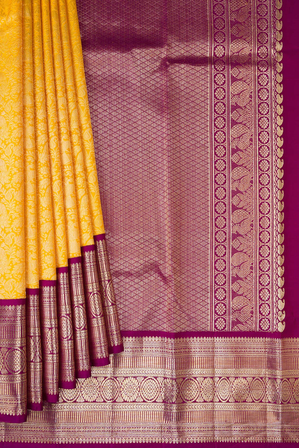 Pleats and pallu of Yellow Kanchipuram Silk Saree with Zari Brocade on the body and Zari Border. 