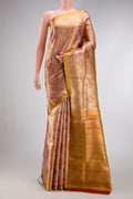 Gold Dual Tone Kanjivaram Tissue Silk Saree with Zari Brocade on the body and Zari Border.  displayed on a mannequin