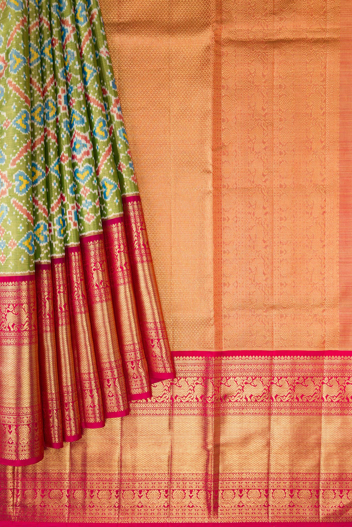 Pleats and pallu of Pure Silk Pure Zari Mehandi Green Dual Tone Kanjivaram Tissue Saree with Ikat Print on the body and Zari Border. 