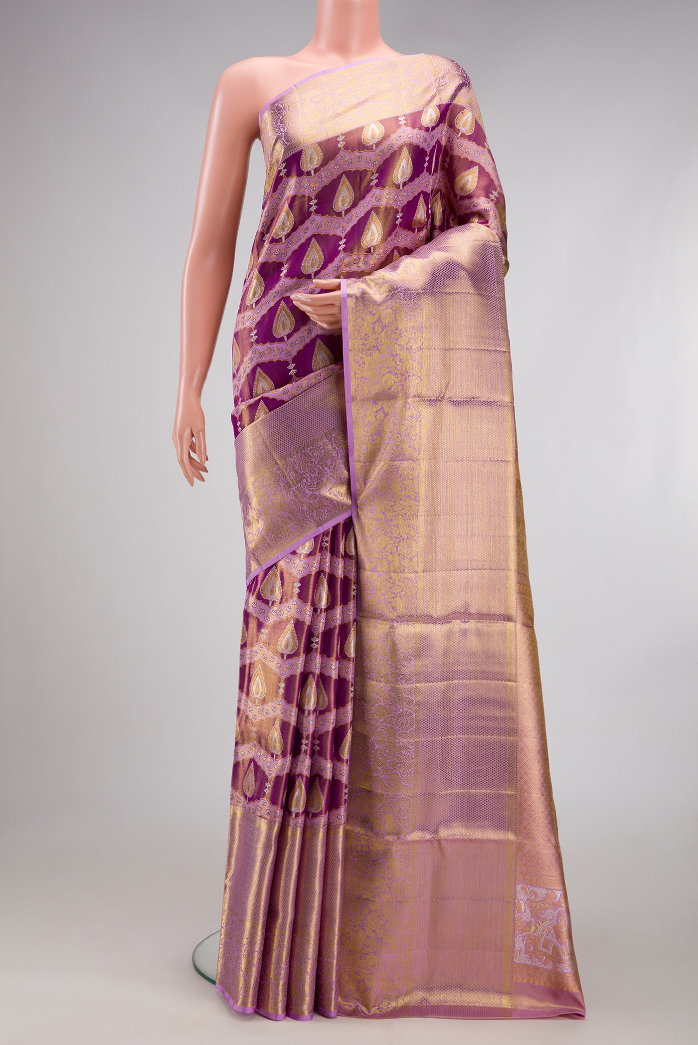Purple Dual Tone Kanjivaram Tissue Silk Saree with Zari Brocade on the body and Zari Border.  displayed on a mannequin