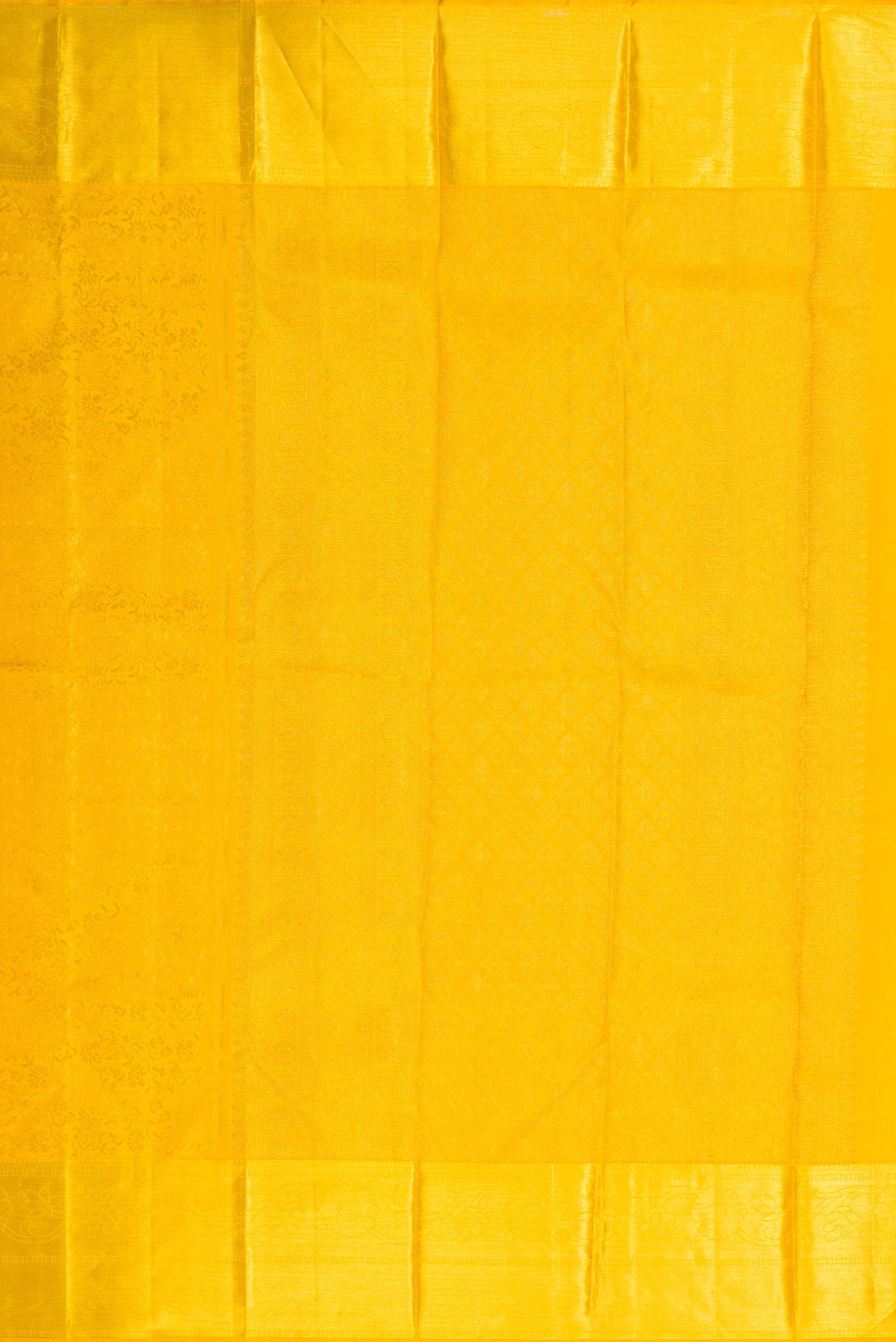 Close up image of the pallu of Yellow Dual Tone Kanchipuram Silk Saree with Zari Brocade on the body and Zari Border. 