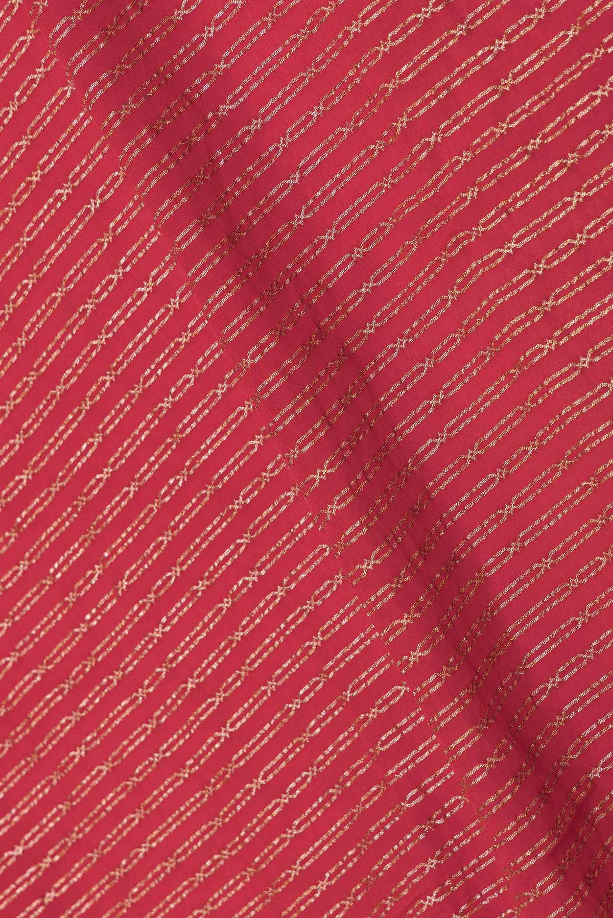 Close up of Red Dual Tone Georgette Saree with Zari Butta on the body and Thin Zari Line displaying folds