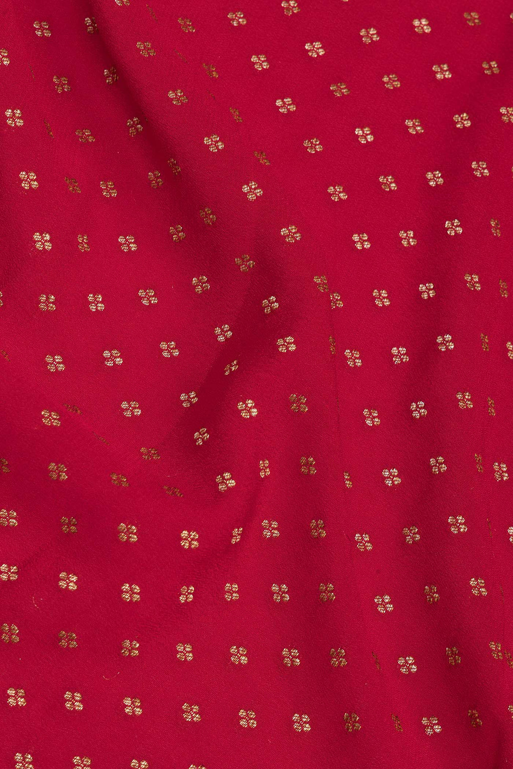 Close up of Red Banarasi Georgette Saree with Zari Brocade on the body and Zari Border.  displaying folds