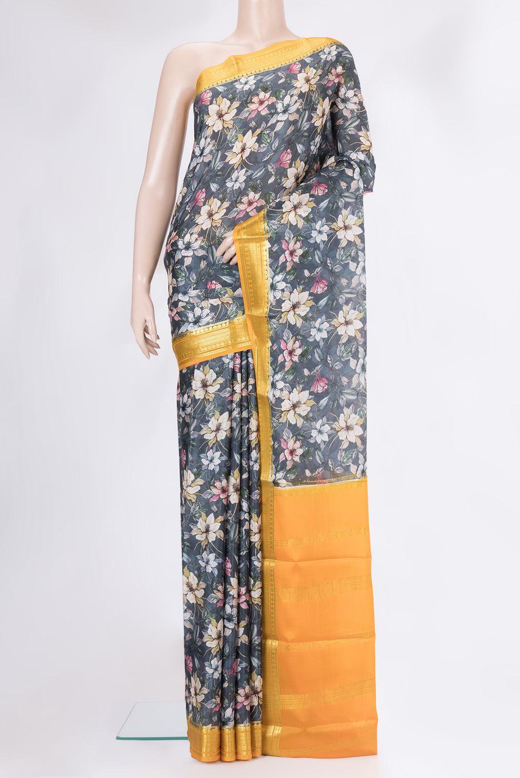 Grey Mysore Silk Saree with Printed design on the body and Zari Border.  displayed on a mannequin