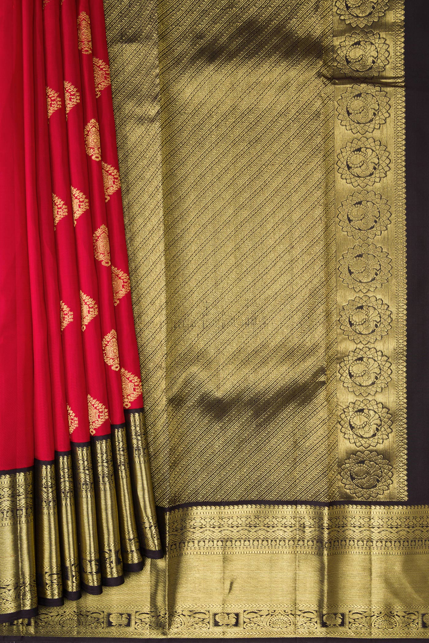 Pleats and pallu of Maroon Dual Tone Kanjivaram Silk Saree with Zari Butta on the body and Fancy Border. 