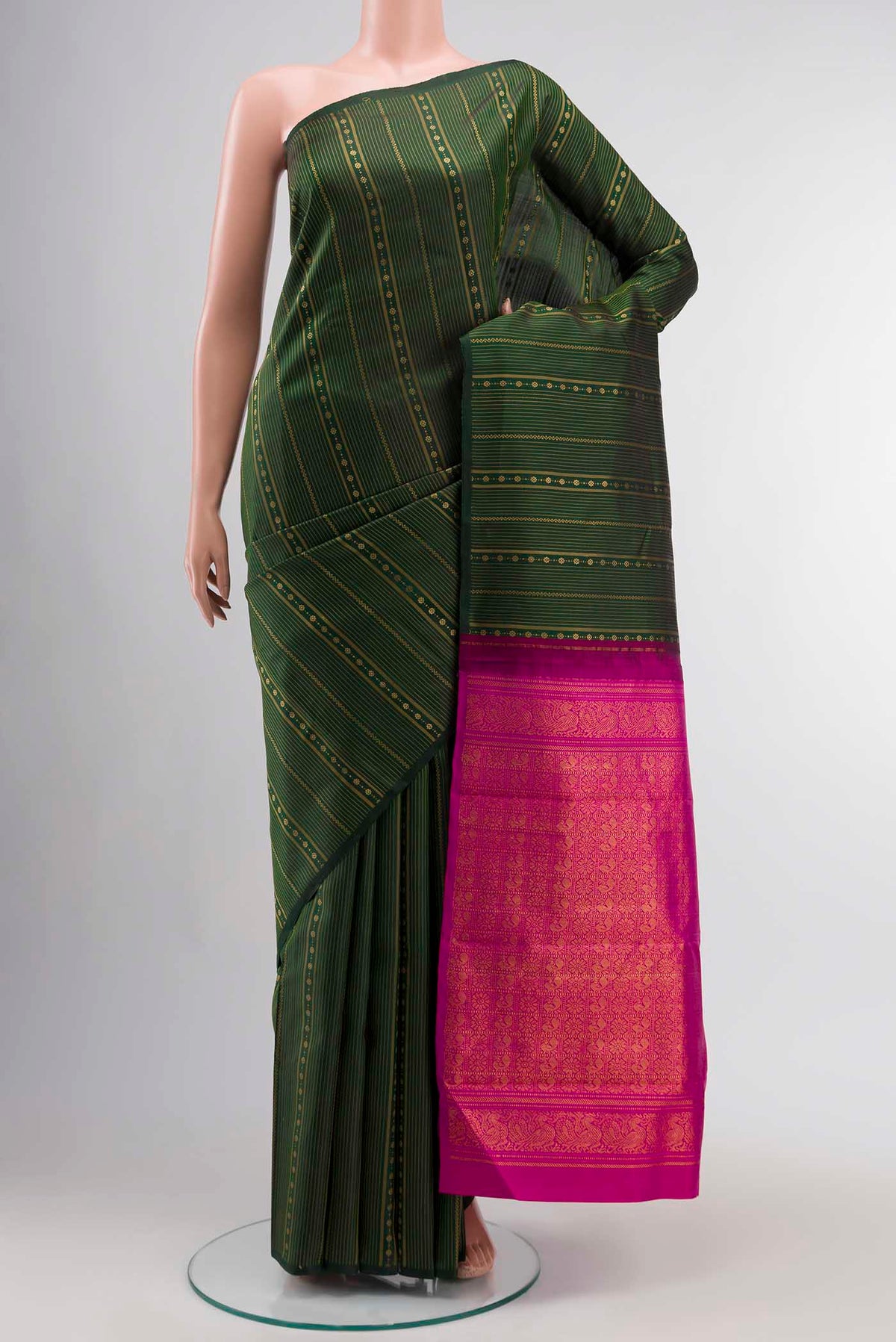 Green Kanchipuram Silk Saree with Stripes on the body and Without Border displayed on a mannequin