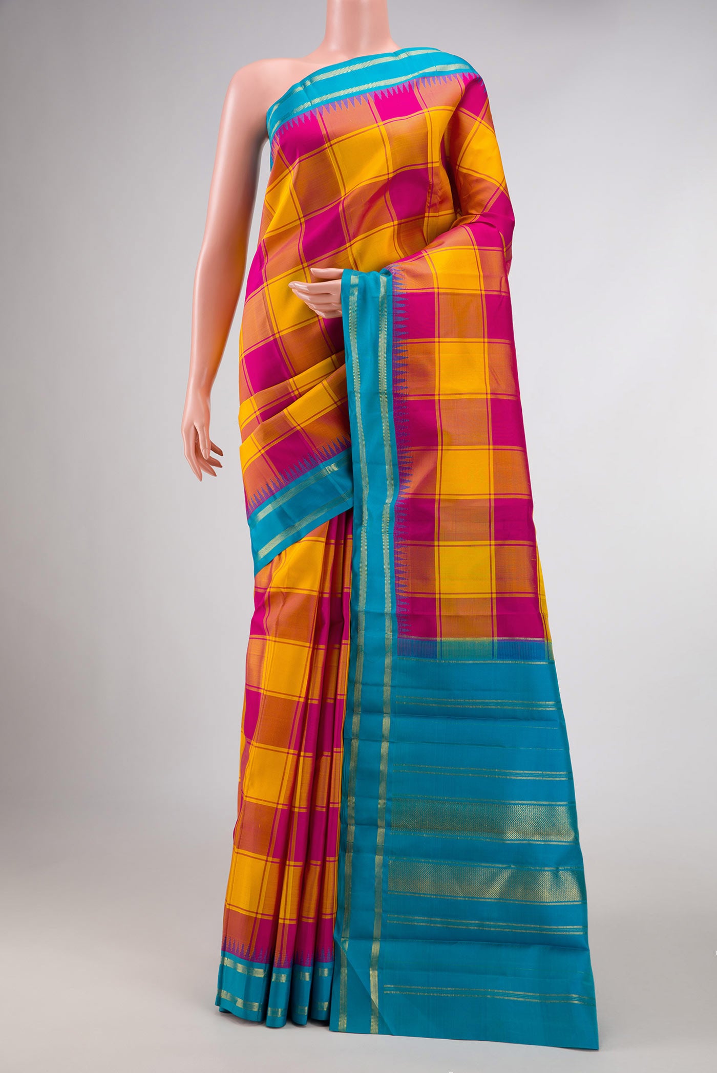 Pure Silk Pure Zari Yellow and Pink Color Kanchipuram Saree with Checked design on the body and Zari Border displayed on a mannequin