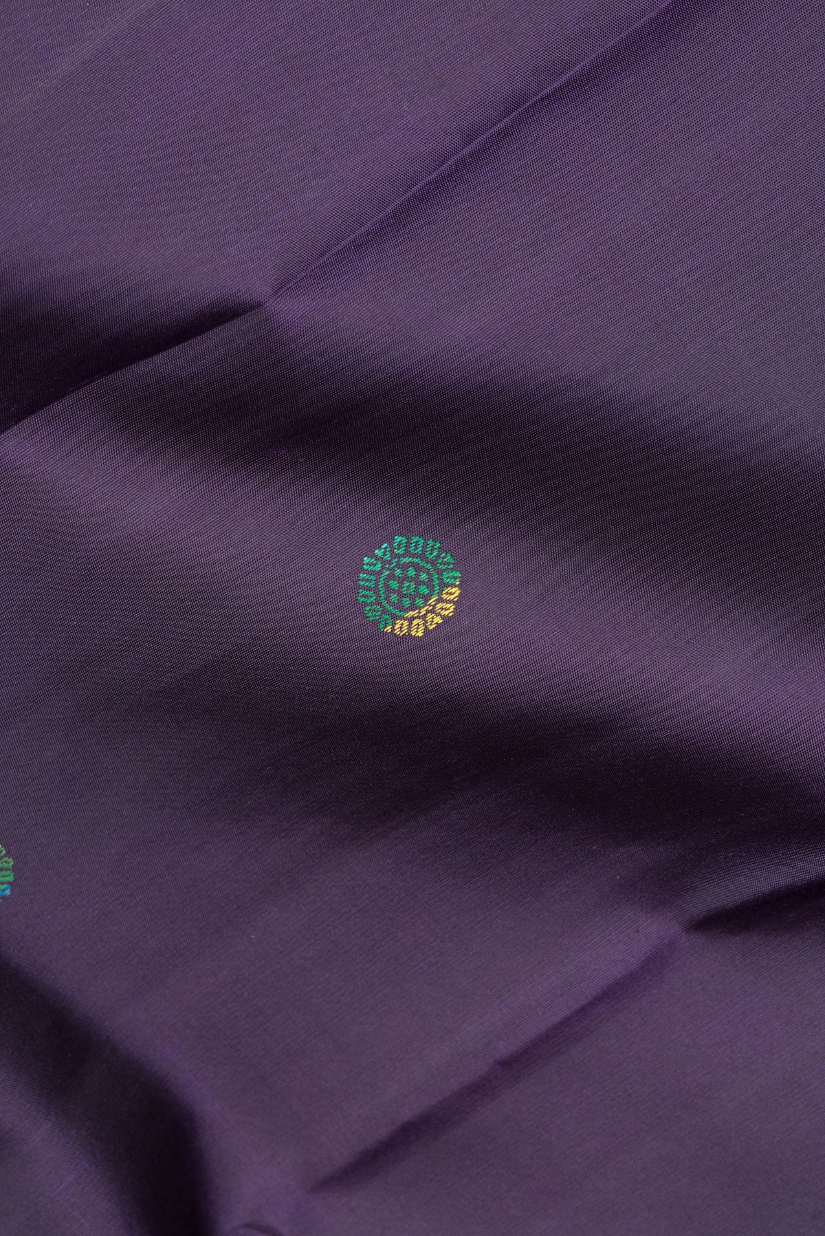 Close up of Pure Silk Navy Blue Kanjivaram Saree with Thread Butta on the body and Thread Border.  displaying folds