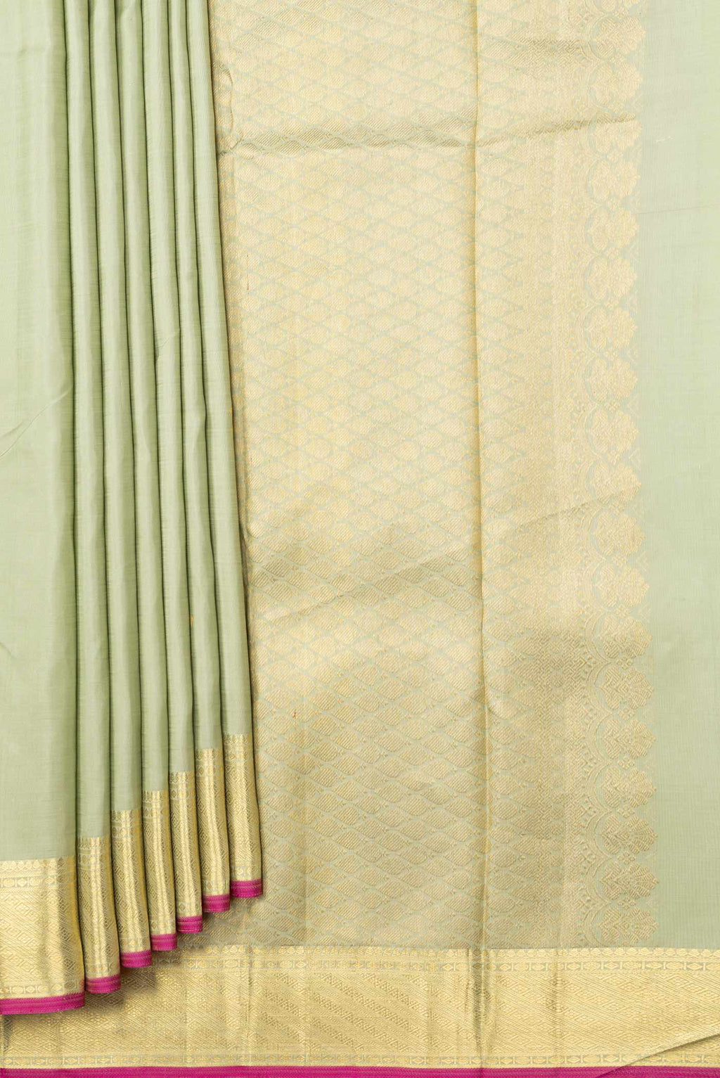 Pleats and pallu of Pista Green Dual Tone Kanchipuram Silk Saree with Zari And Thread Butta on the body and Zari Border. 